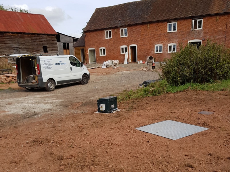 Wyre Drainage engineers on site completing an inspection cover installation for a sewage and waste water system