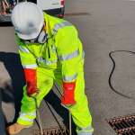 Plumber inspecting drainage system