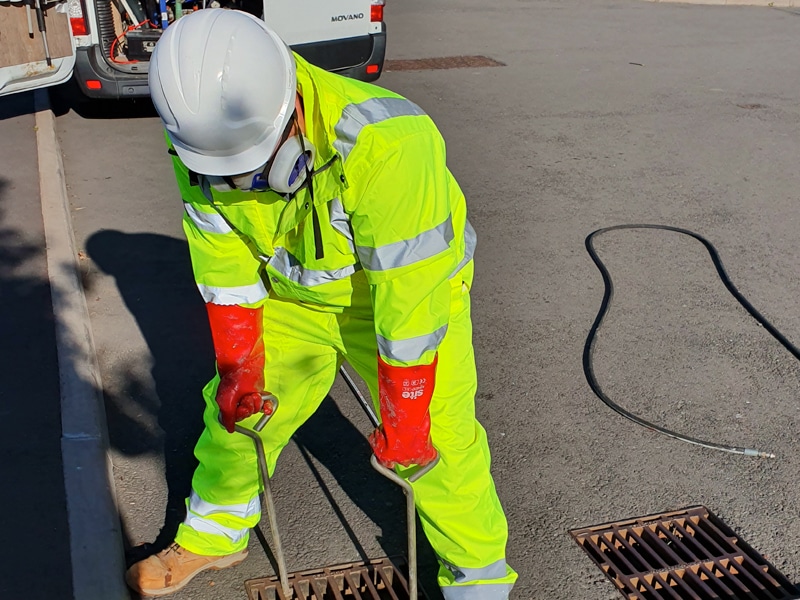 Plumber inspecting drainage system